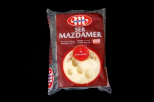 Fromage MAZDAMER en bloc 250g. Le fromage de type suisse se caractérise par un goût doux et sucré et une chair élastique